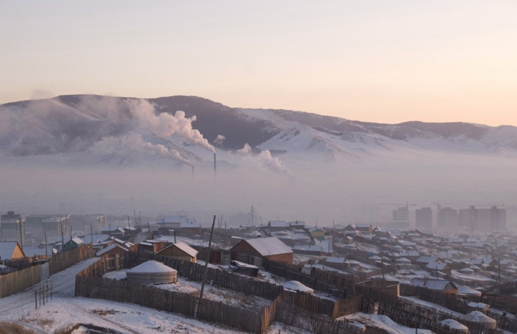 Pollution hangs over Ulaanbaatar in Mongolia, where many of the 1.3 million residents burn wood and coal to keep warm. Photograph: Peter Oetzmann/EPA.