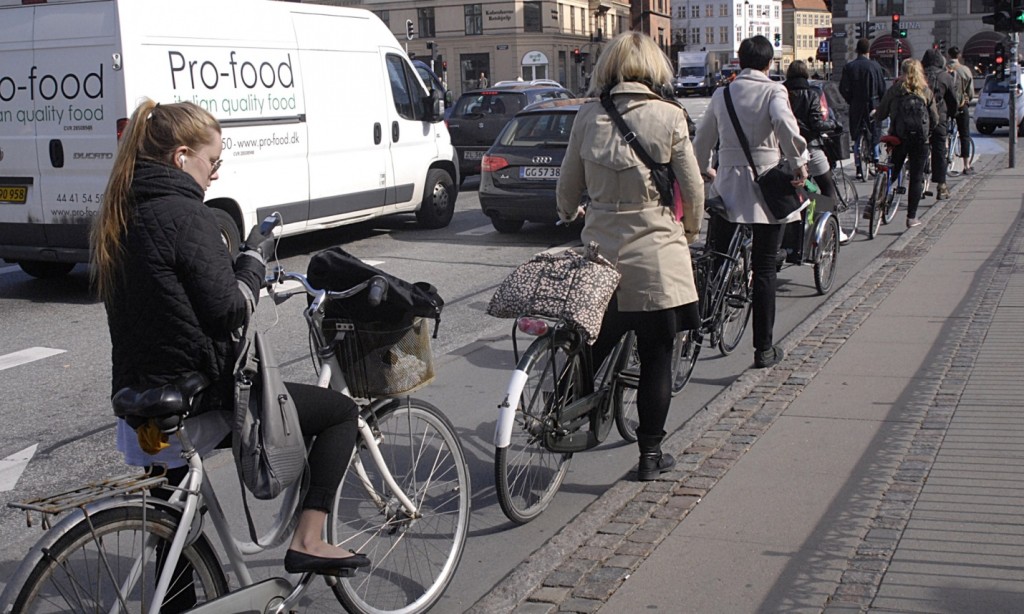 Cyclists in Copenhagen queue patiently for traffic lights – better design leads to better behaviour. Photograph: Francis Dean/Rex